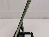 a tablet that is sitting on a stand on the table