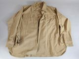 an image of a tan jacket on a white background