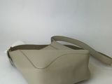 an image of a white purse on a white surface