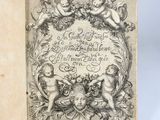 an open book with a drawing of chers and angels on it