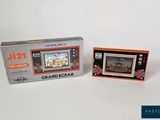 a picture of a game console and a game box