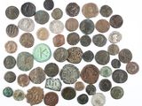 an image of a pile of old coins on a white surface