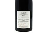 a bottle of wine that is sitting on a table