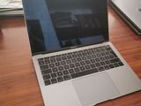 a laptop that is sitting on a wooden table