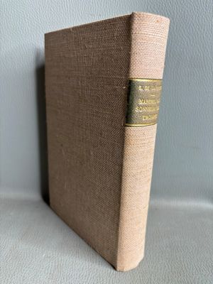 a close up of a book sitting on top of a table