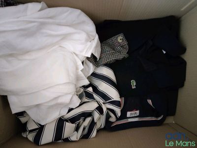 a box full of clothes and a shirt in it