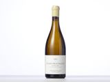 a bottle of white wine sitting on a table