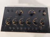 a close up of a black electronic device with buttons and knobs