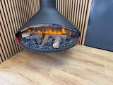a fireplace that is sitting on top of a wooden table