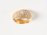 an image of a gold ring with diamonds on a white surface