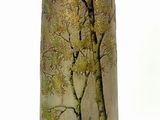 a vase that has a picture of a tree on it