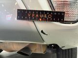 a close up of a sticker on a car ' s tail light