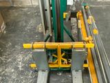 a picture of a fork lifter in a warehouse