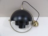 a black lamp that is on a white table