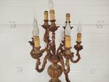 a candle holder that has five candles on it