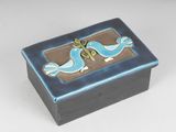 a small blue box with two birds on it