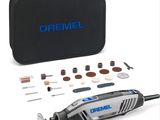 the dremel corded sander is in a case with tools