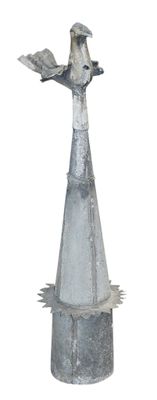 a metal sculpture of a bird on top of a cone
