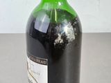a bottle of wine that is sitting on a table