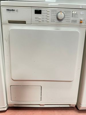a white washer and dryer sitting next to each other