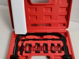 a red case with tools in it sitting on a table