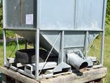 an image of a machine that is sitting in the grass