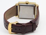 an image of a close up of a wrist watch on a white surface