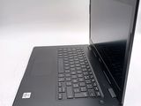 a laptop with a black keyboard on a white surface
