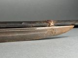 a close up of a knife on a table
