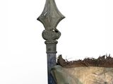 a small planter with a sword on top of it