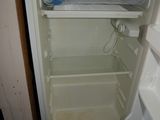 an open refrigerator with a lot of food inside of it