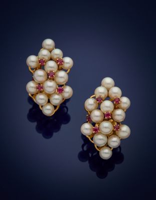 a pair of pearl and ruby earrings