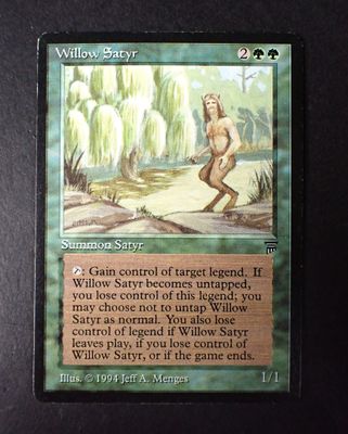 a close up of a card with a picture of a man in a forest
