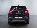 the rear end of a black car in a white room