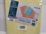 a pile of yellow sheets of paper sitting on top of a counter