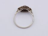 an old cut diamond ring set in white gold with an old cut diamond