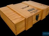 a large wooden box with a black label on it