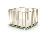 a small crib with a white mattress in it