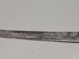 a knife that is laying on a table