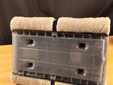 a close up of a plastic container on a wooden table