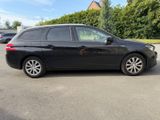 a picture of a black car parked in a parking lot