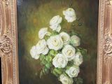 a picture of a painting of white roses in a gold frame