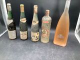 several bottles of alcohol are lined up on a counter