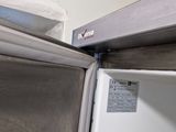 a white refrigerator with a door open in a kitchen