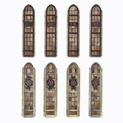 six stained glass windows in different shapes and sizes