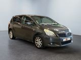 grey toyota venza parked in a showroom with a black floor