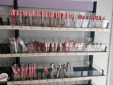 a lot of lipsticks on the shelves in the store