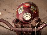 a close up of a motorcycle with a clock on it ' s handlebars