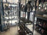a room with a lot of different items on the shelves
