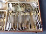 a case with a bunch of silverware in it